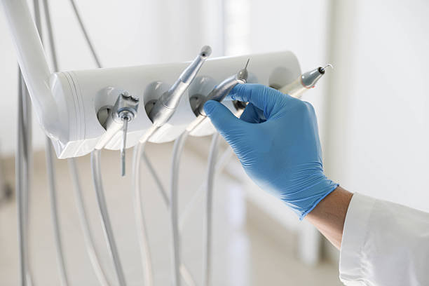 Professional Tooth Extraction technician working in Falkville, AL